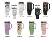 A catalog grid showing ten insulated travel tumblers in different colors, each with a black handle and lid, printed with various inspirational quotes and designs. The colors shown are White/Black, White/Gold, Black/Black, Black/Prism, Black/Gold, Lilac/Black, Sand/Black, Sage/Black, and Blush/Black.