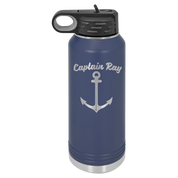Navy blue water bottle with custom engraved boat captain logo with a black lid on a white background